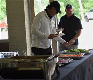 golfers in serving line